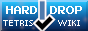 A button with a blue to dark-blue background with the HardDrop wiki logo in the middle, and text around it that reads:'Hard    Drop' 'tetris    wiki'
